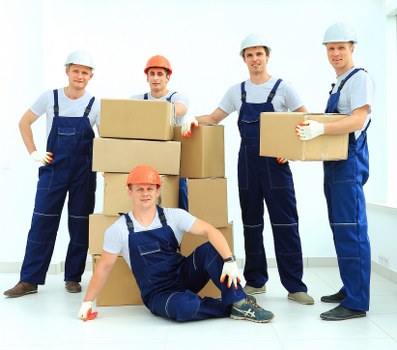 Moving van loading boxes and furniture for a Paddington service booking