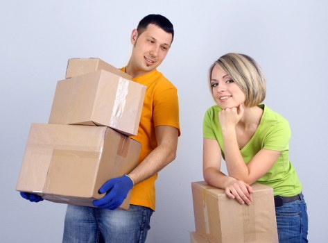Office relocation team transporting desks and equipment
