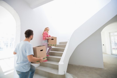 Professional movers carrying furniture during a same day relocation in Paddington