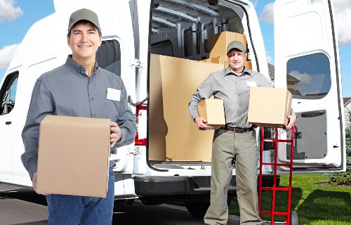 Paddington moving service handling boxes and furniture carefully